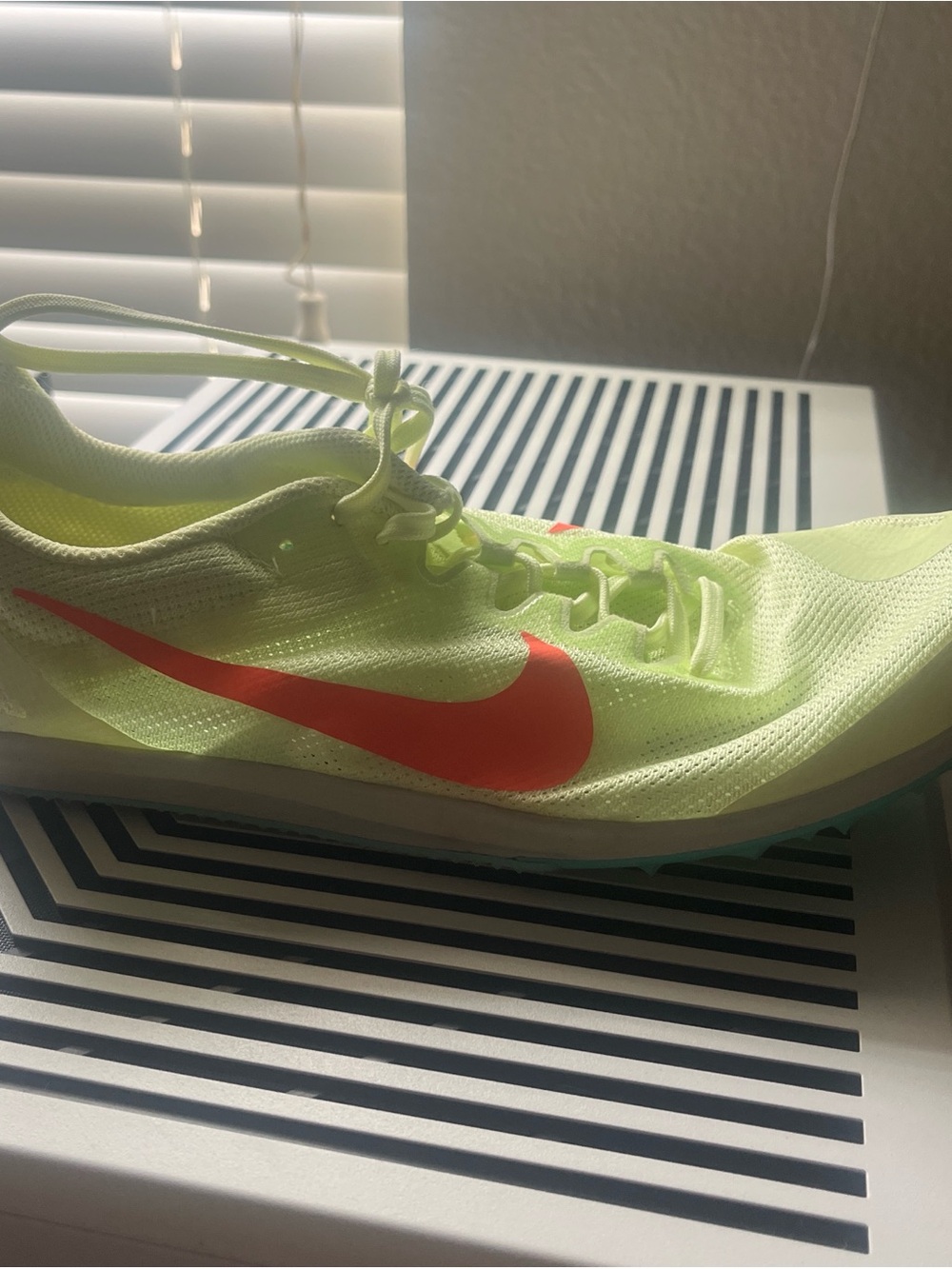 Nike Volt Running Shoe with Bright Coral Swoosh